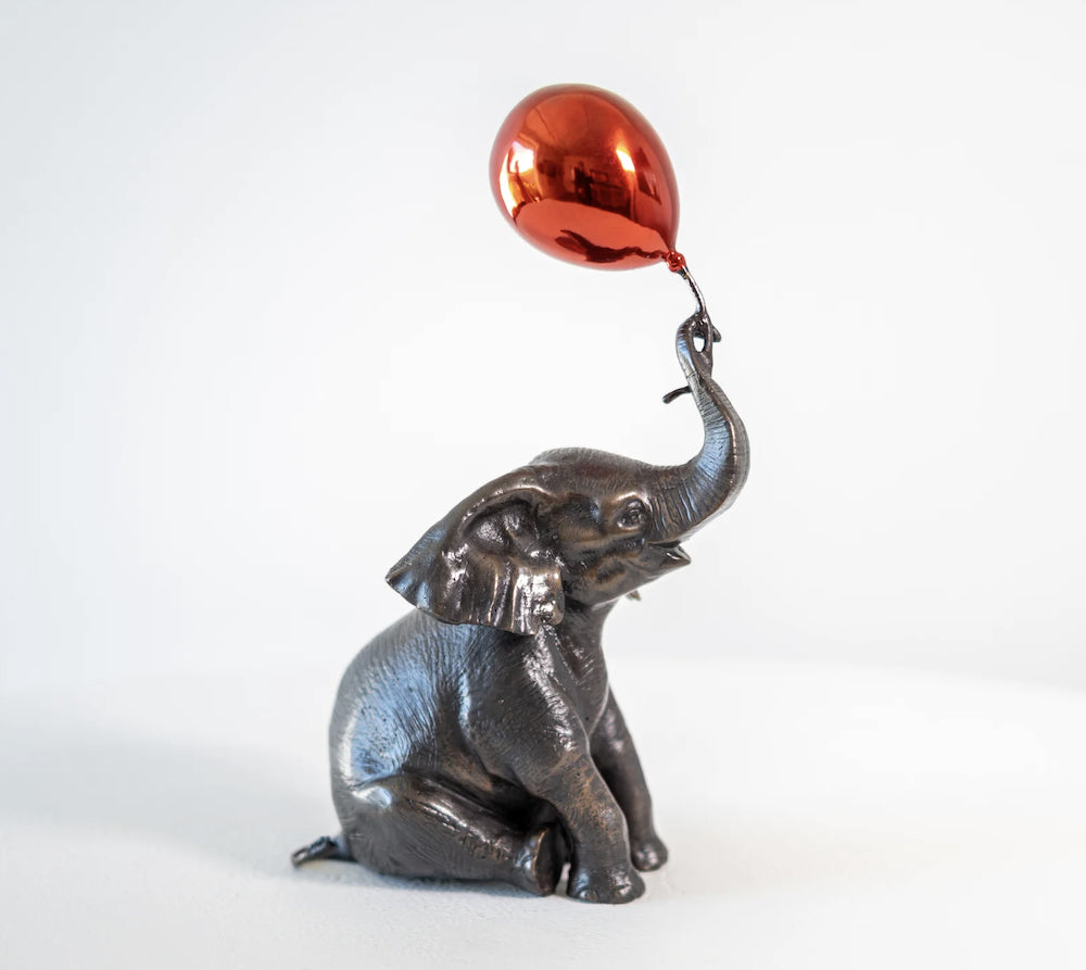 Elephant Makes a Wish with Red Balloon